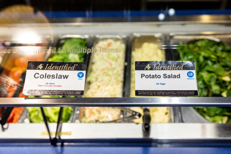 An image of vegan and lacto-ove food labels in the C4C dining center on campus