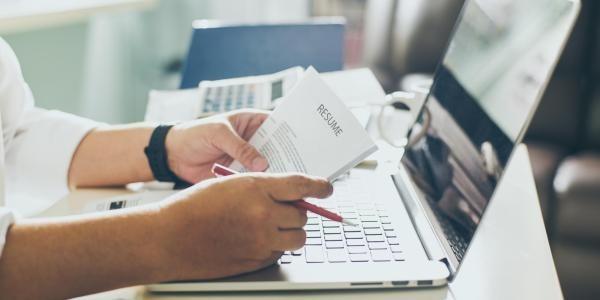 Person holding a resume