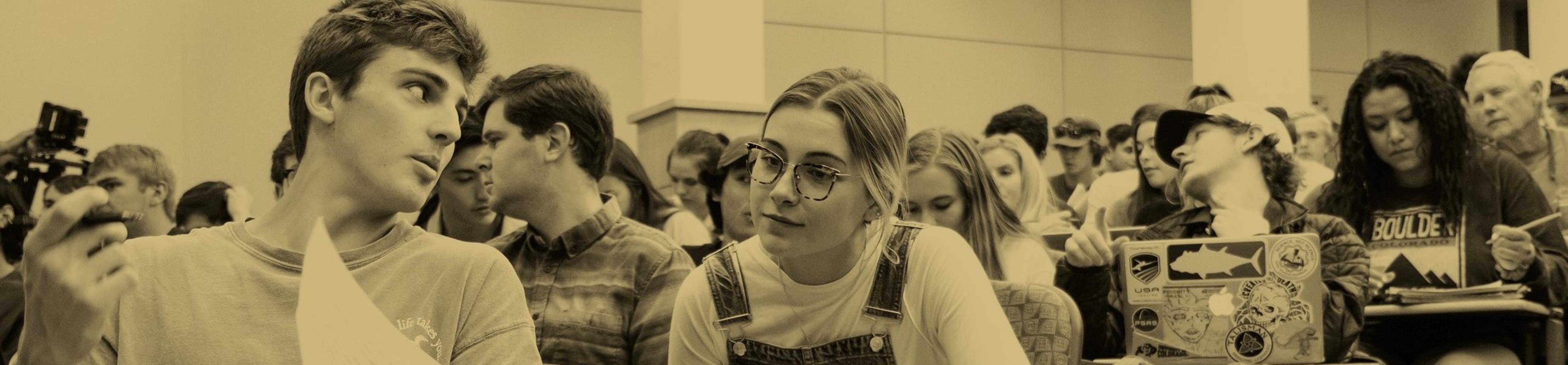 students talking to eachother in a classroom