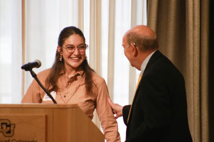student employee accepting award