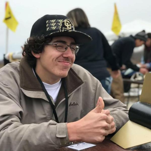 Mason Moran posing with his team's FNL rocket