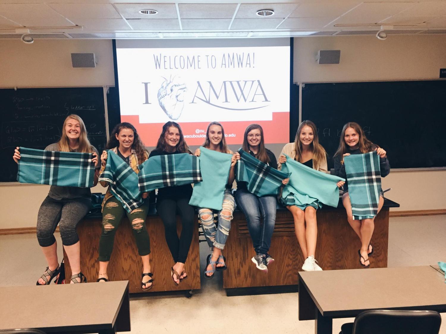 AMWA members making heating pad covers for Boulder Valley Women's Health Center