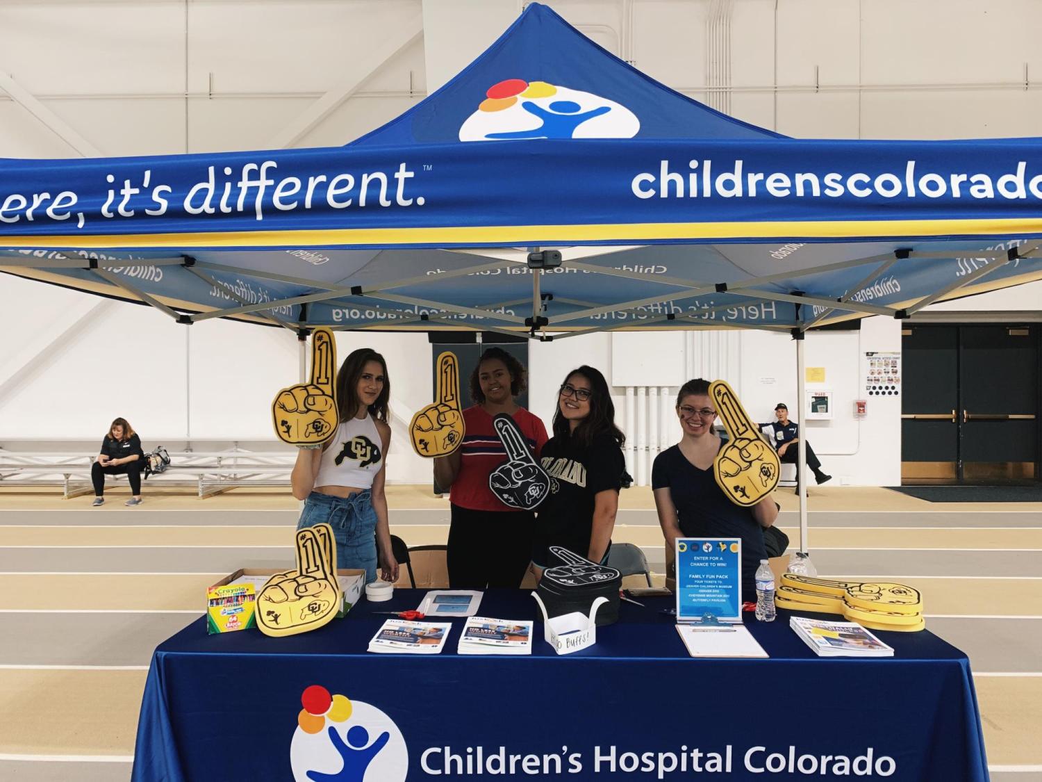 AMWA members volunteering at a football game!