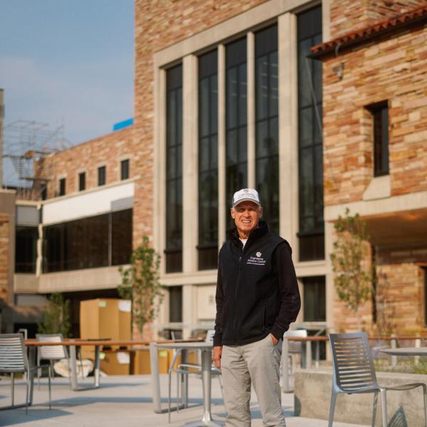 Associate Dean Doug Smith standing in front of the expansion. He is smiling.