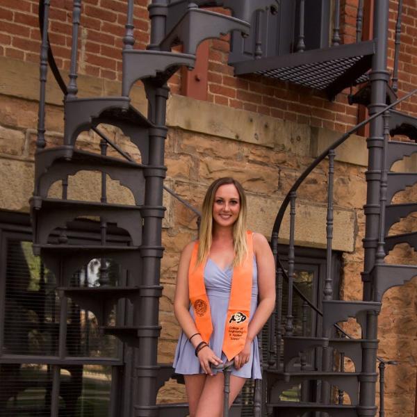 Erika Polhamus standing in spiral staircase