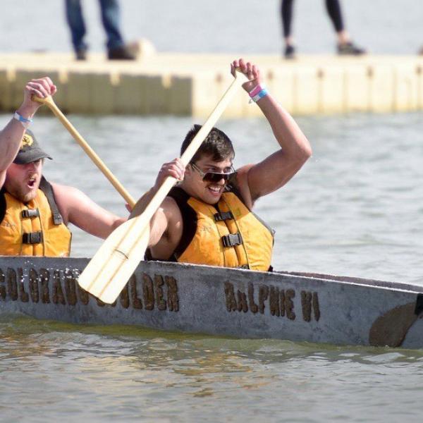Two students rowing in concrete canoe