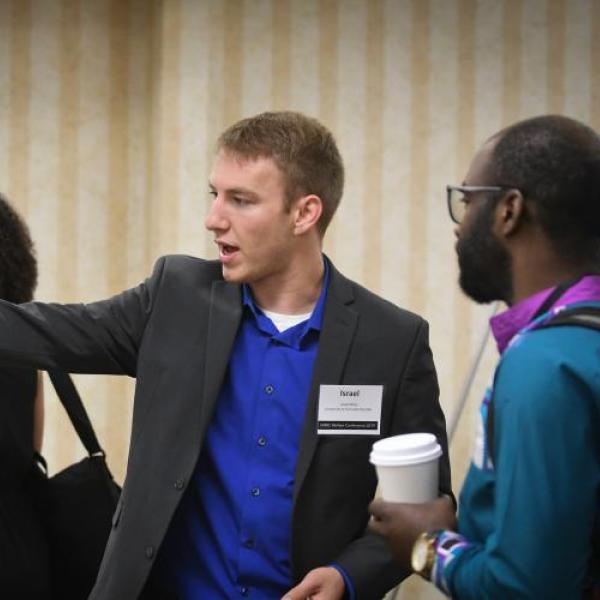 Israel Miles presenting research poster