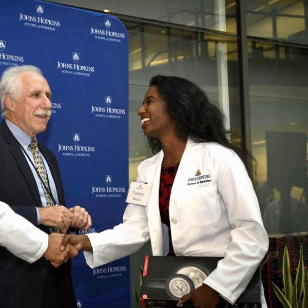 Vismaya Bachu shaking hands with doctors