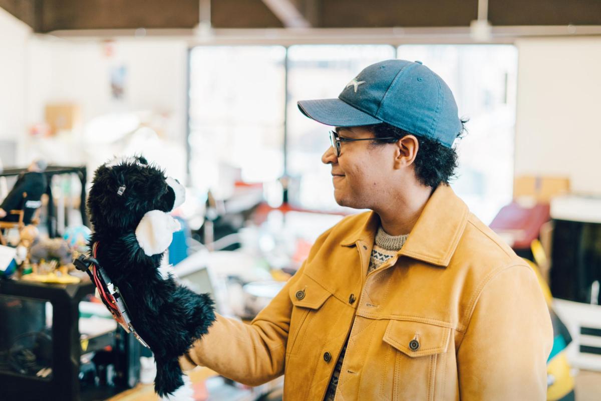 Christian Hill with a robotic glove puppet