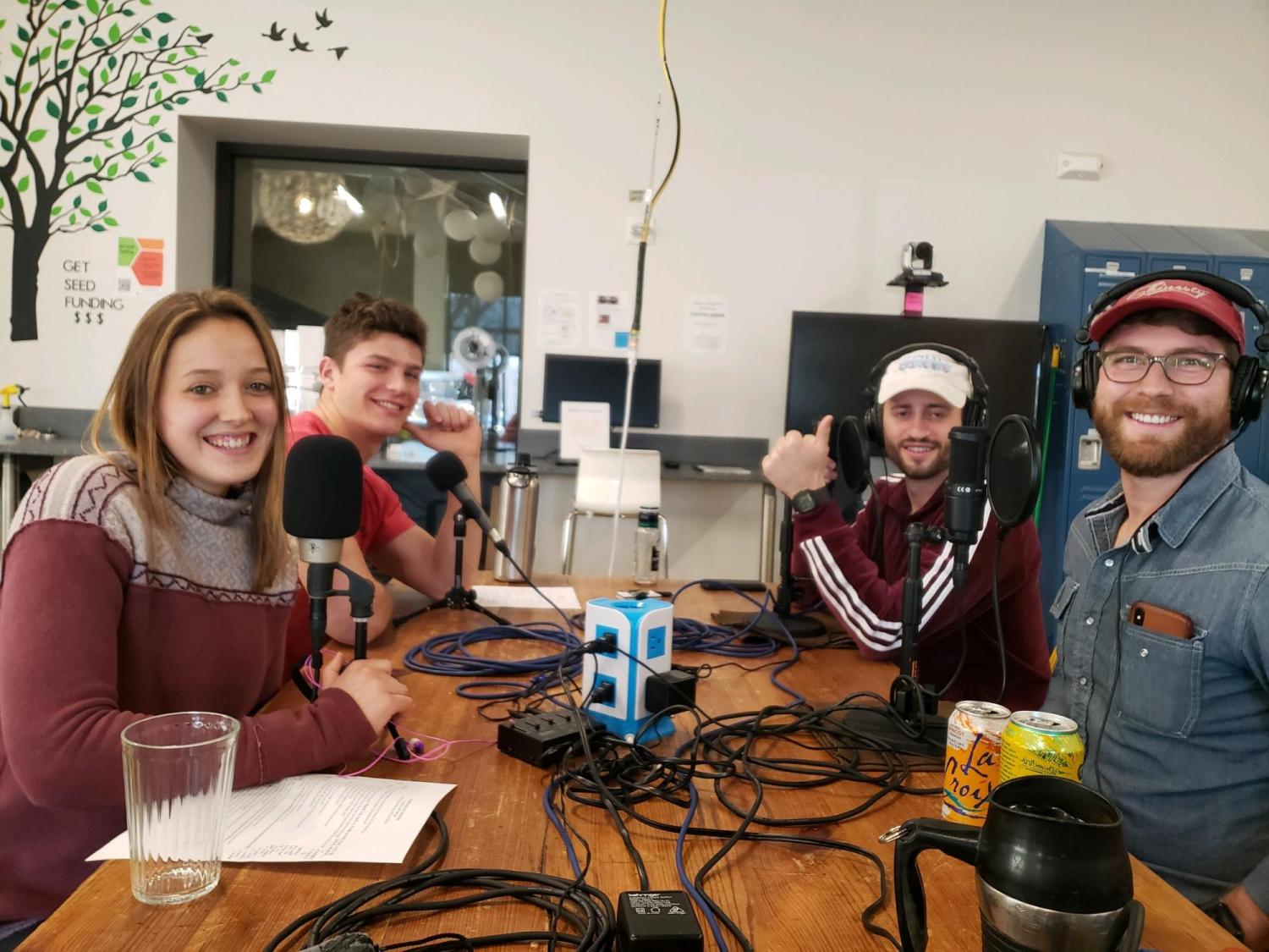 Four podcast students smiling