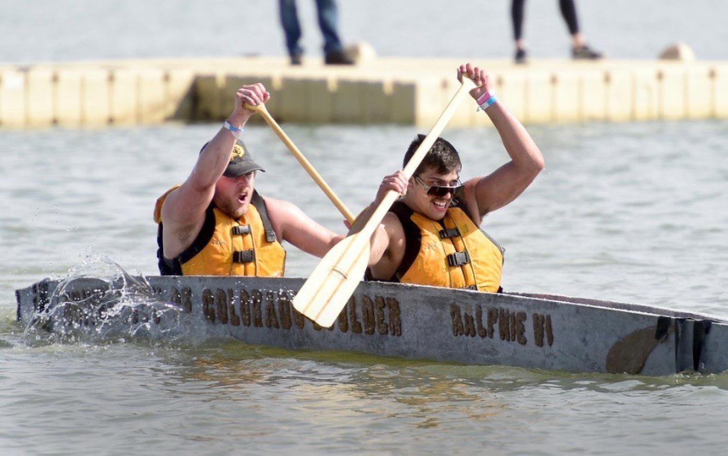 Two students rowing in concrete canoe