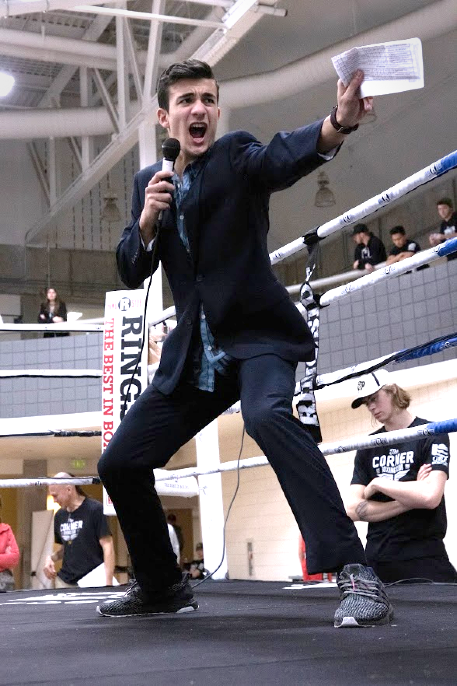 Boxing announcer yelling into microphone