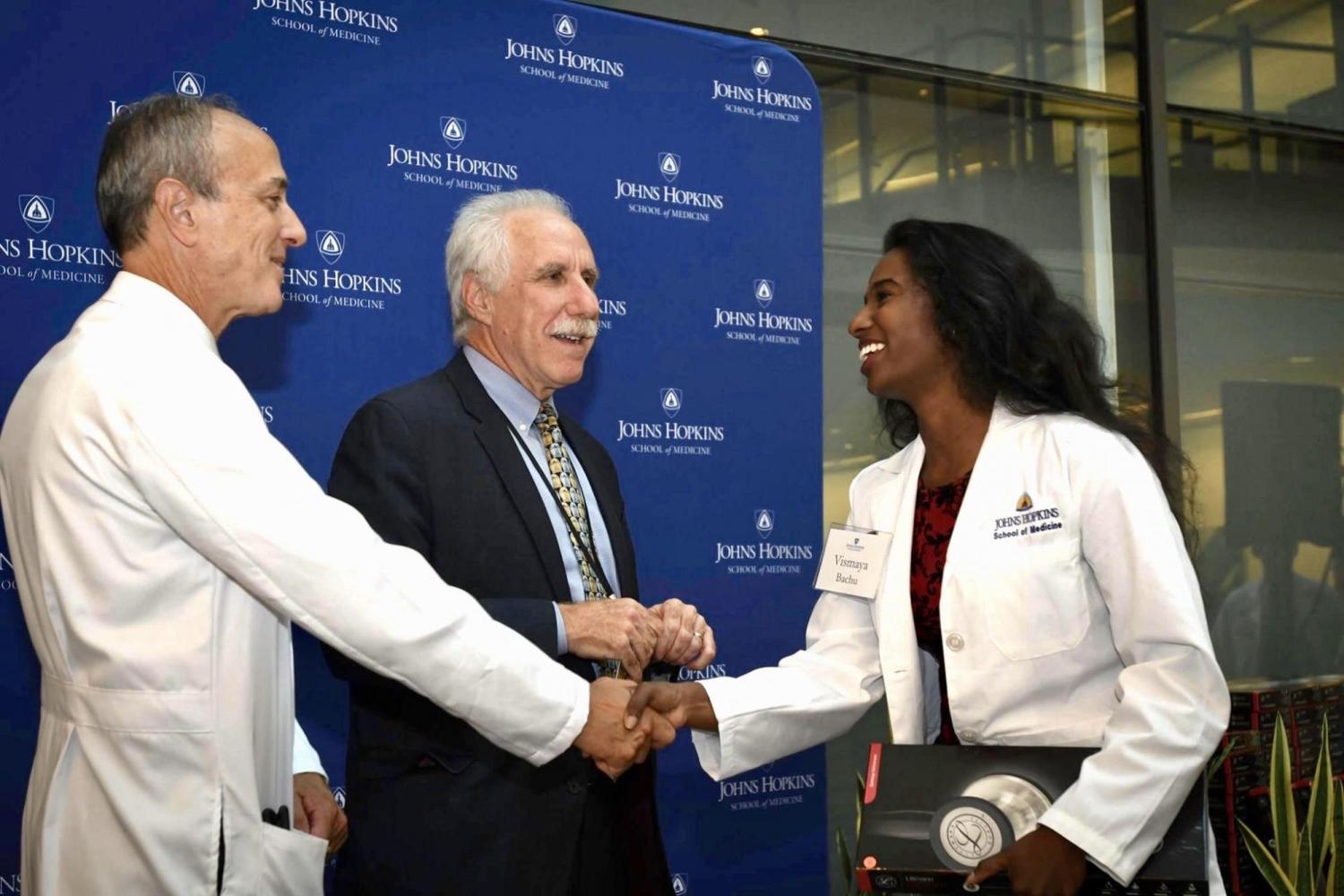 Vismaya Bachu shaking hands with doctors