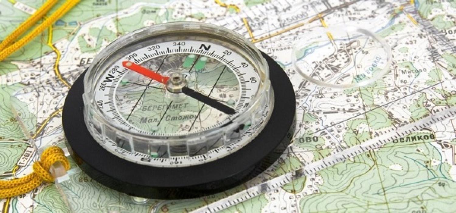 compass laying on map