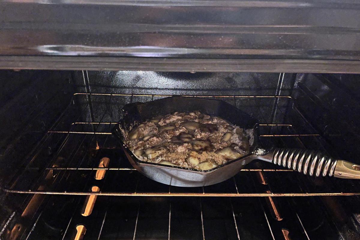 apples baking in a cast iron skillet