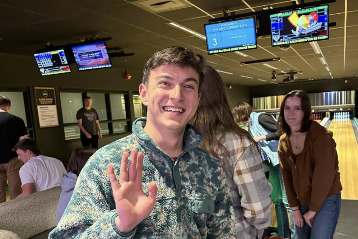 a person waving at the camera