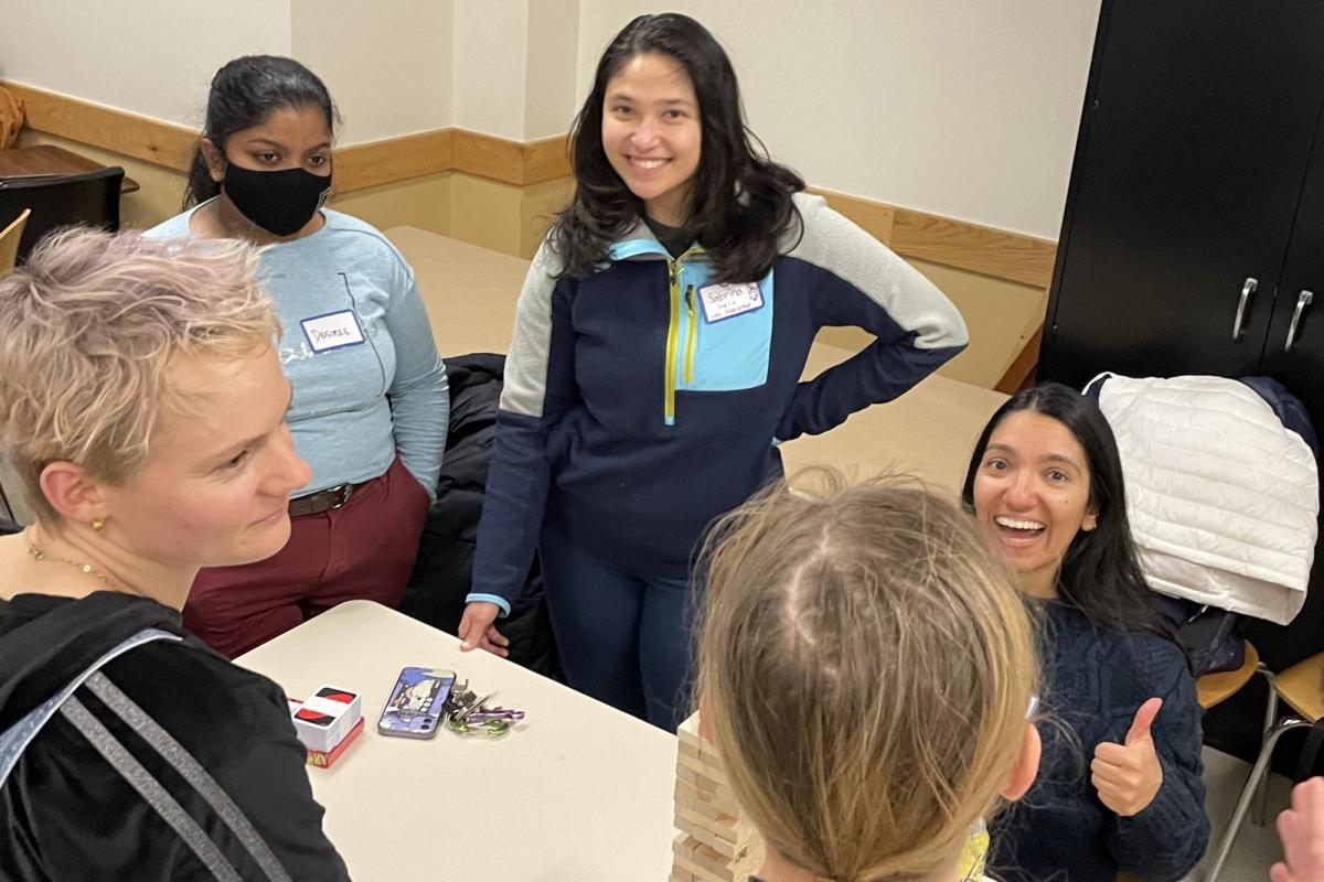 group of diverse young women playing a game