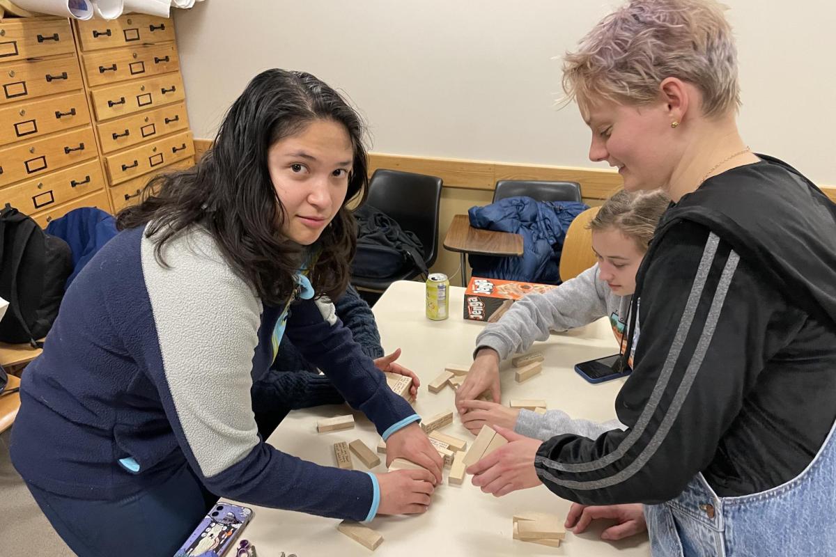 two young women playing Jenga