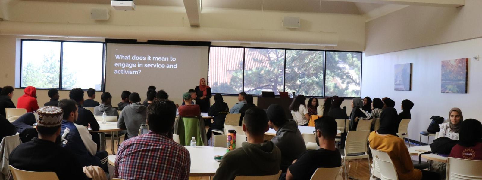 Students looking at a powerpoint presentation
