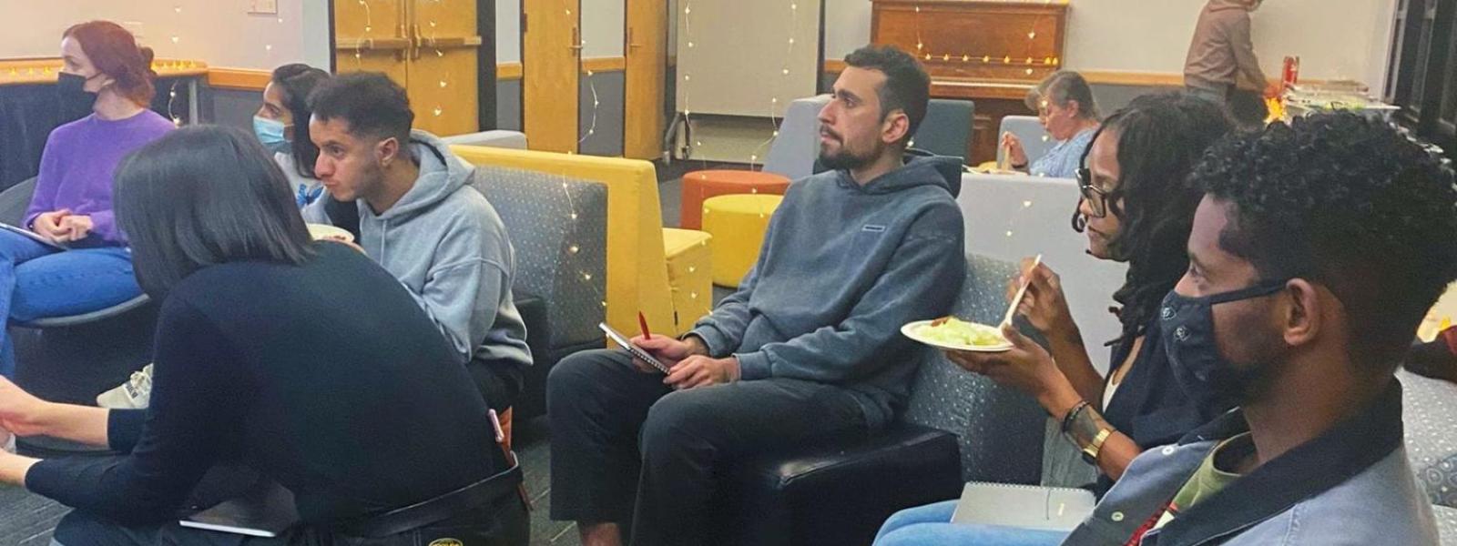 Students looking focused listening in a meeting