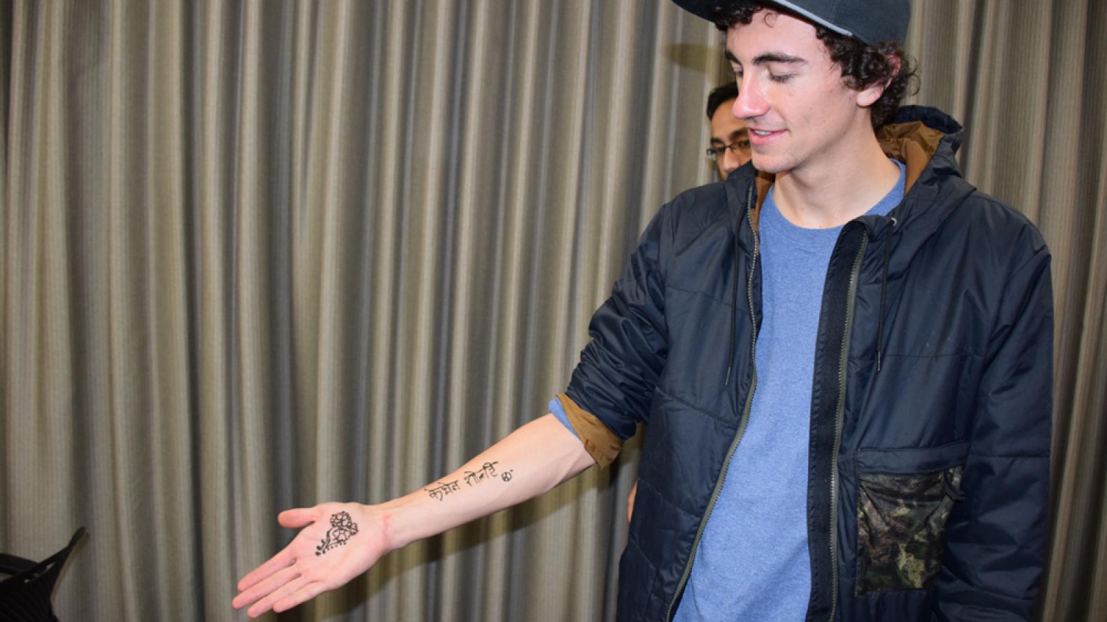 Student showing off henna tattoo