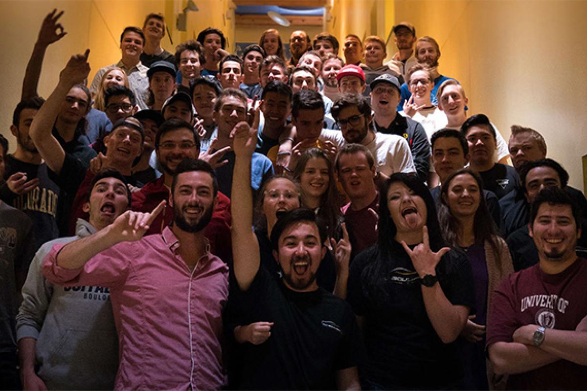 Team members celebrating in stairwell