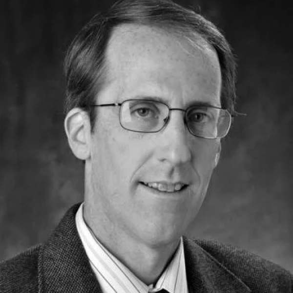 Photo of Dr. Cowell, a light-skinned man with short light hair and wire-frame glasses