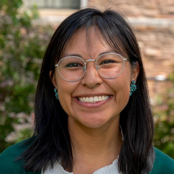 Photo of Saydie, a young Native woman with dark skin and shoulder-length dark hair