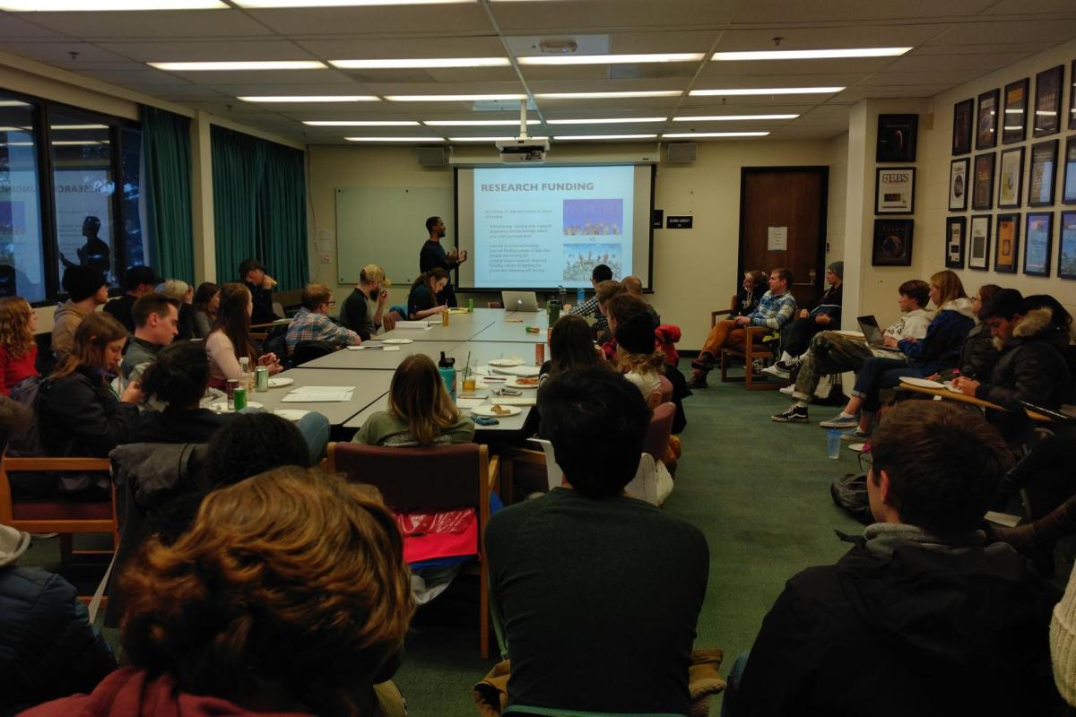 STEM Routes students in a classroom watching a workshop.