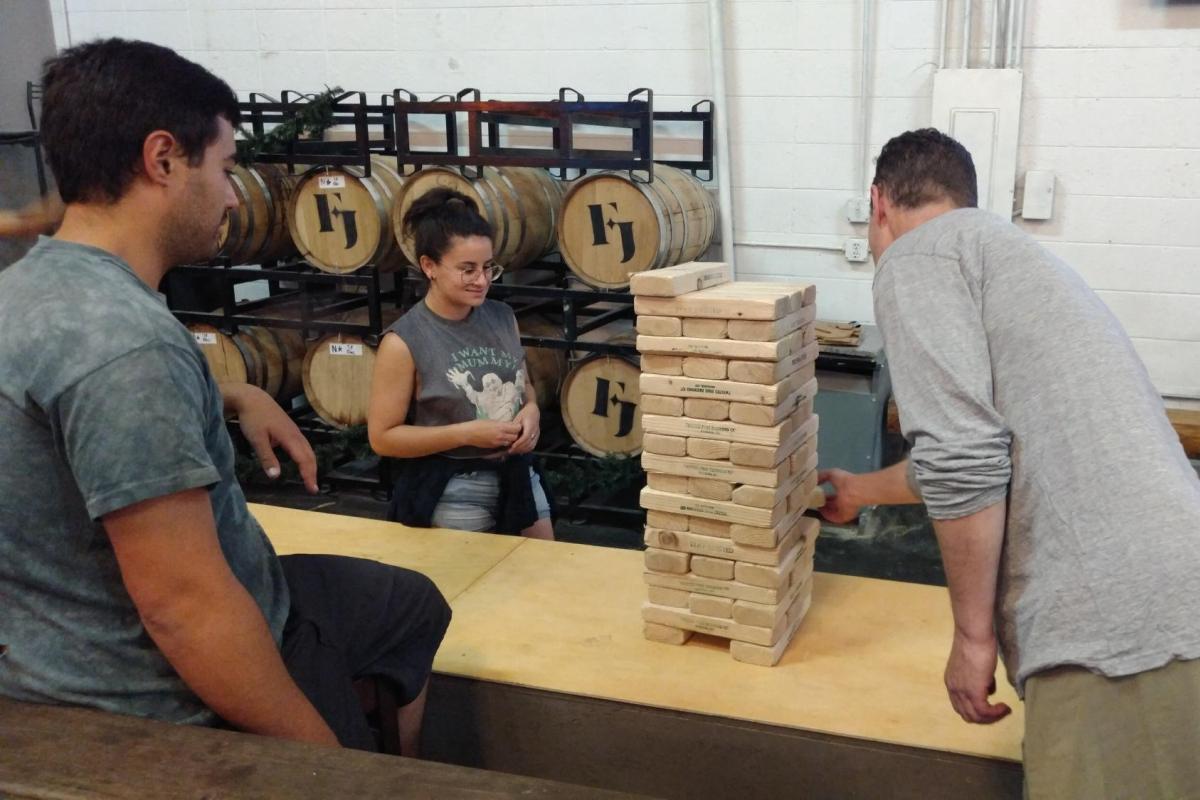 STEM Routes students hanging out and playing jenga.