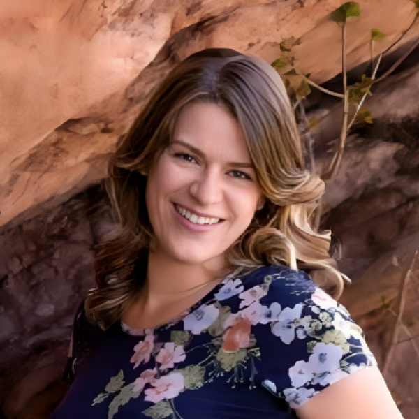 Image of Dr. Stephanie Boyce. Brown hair. Floral shirt.
