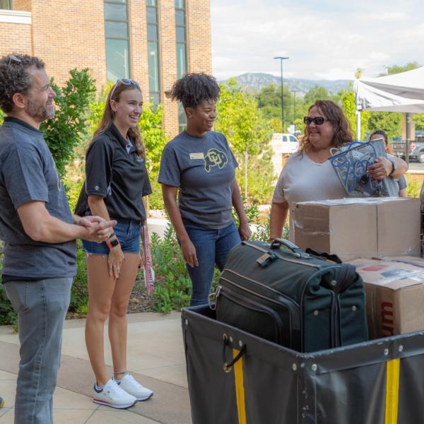 President Todd Saliman and Vice Chancellor for Student Affairs, Akirah Bradley, visit with new Buffs on Move-in Day