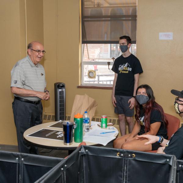 Chancellor DiStefano talking with RAs during move-in