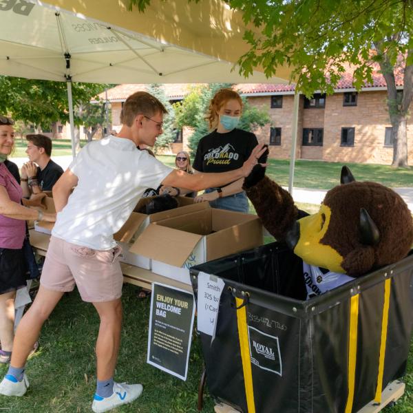 Chip welcoming new students during move-in