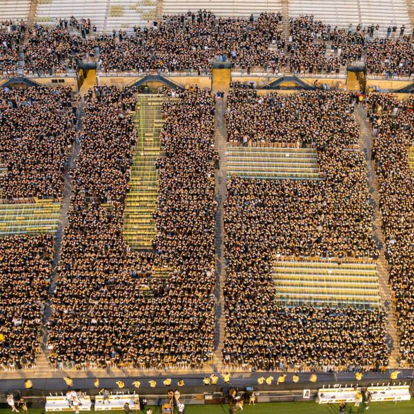 students form CU 28 in bleachers