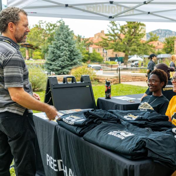 Chancellor talking with students at move-in