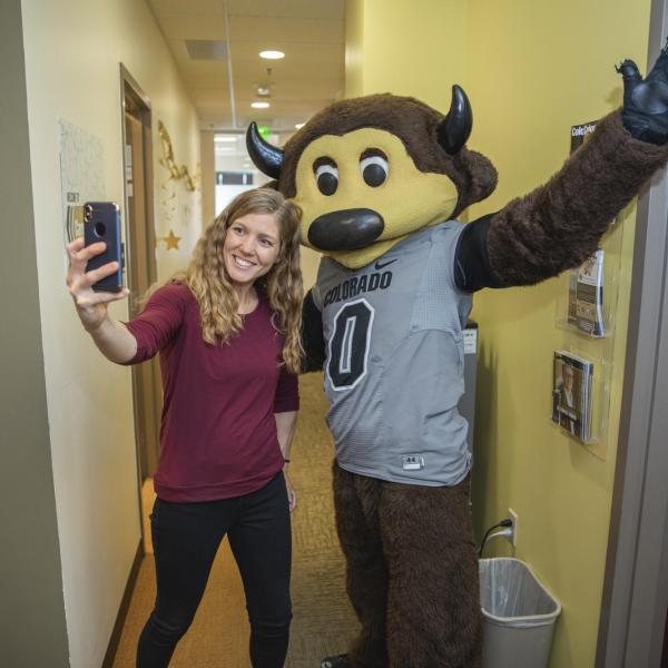 Chip visits Career Services staff to hand out gift bags and pose for pictures during Random Acts of Kindness Week