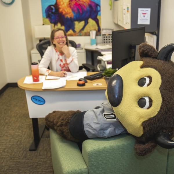 Chip visits Career Services staff to hand out gift bags and pose for pictures during Random Acts of Kindness Week