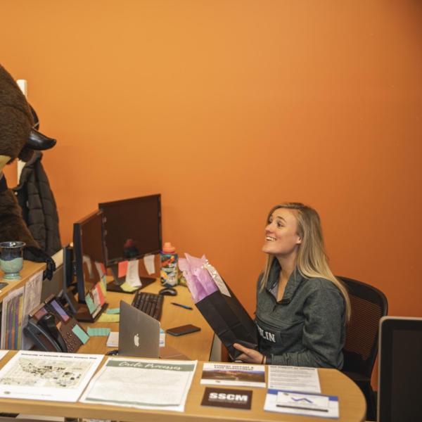 Chip visits Student Conduct and Conflict Resolution staff to hand out gift bags and pose for pictures during Random Acts of Kindness Week