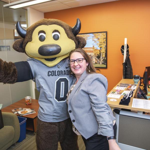 Chip visits Student Conduct and Conflict Resolution staff to hand out gift bags and pose for pictures during Random Acts of Kindness Week