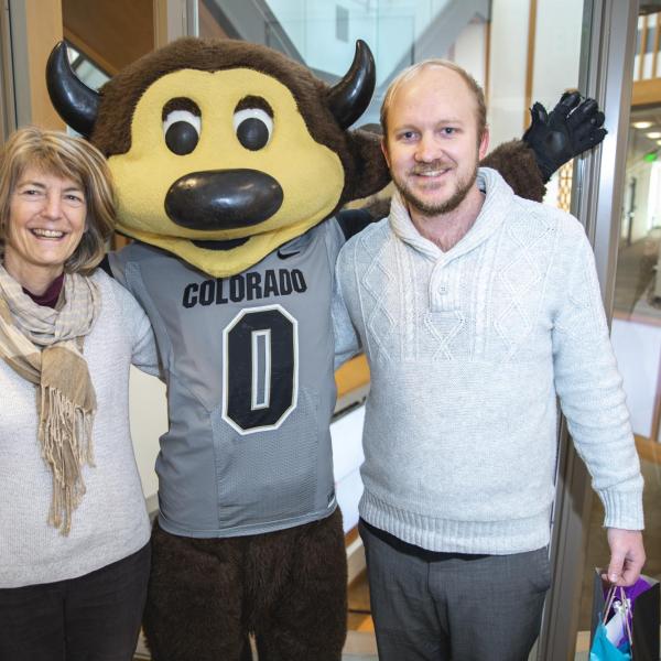 Chip visits Counseling & Psychiatric Services staff to hand out gift bags and pose for pictures during Random Acts of Kindness Week
