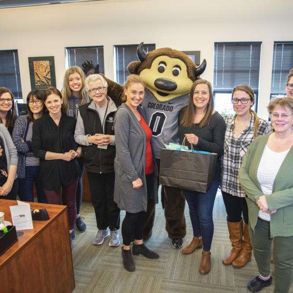 Chip visits Housing staff to hand out gift bags and pose for pictures during Random Acts of Kindness Week