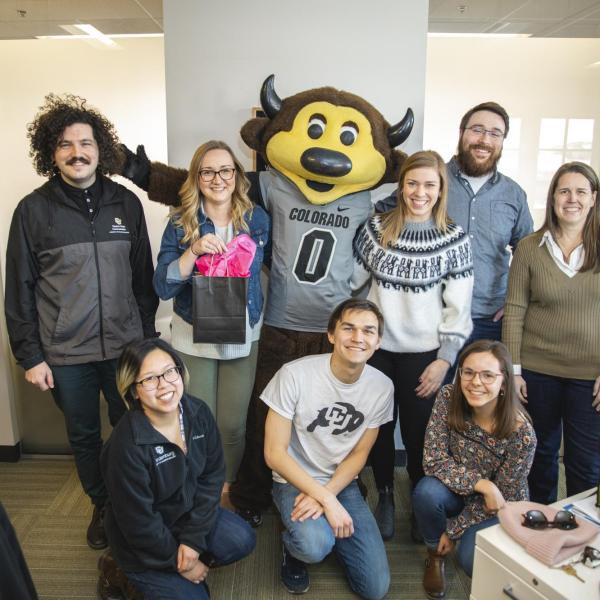 Chip visits Student Affairs Communication and Marketing staff to hand out gift bags and pose for pictures during Random Acts of Kindness Week