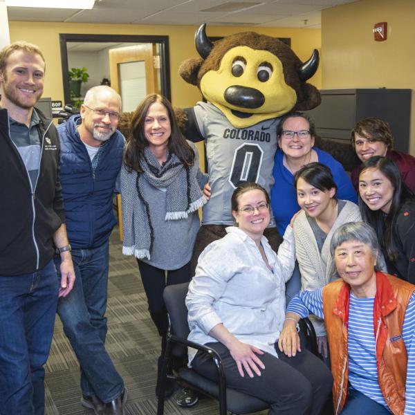Chip visits Student Affairs Financial Services staff to hand out gift bags and pose for pictures during Random Acts of Kindness Week