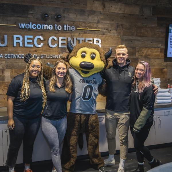 Chip visits Rec Center staff to hand out gift bags and pose for pictures during Random Acts of Kindness Week