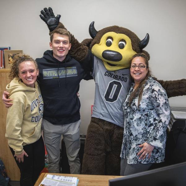 Chip visits Rec Center staff to hand out gift bags and pose for pictures during Random Acts of Kindness Week