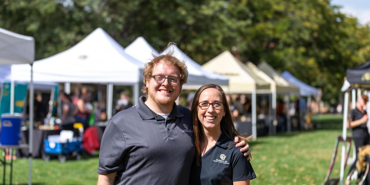 Two staff members posing