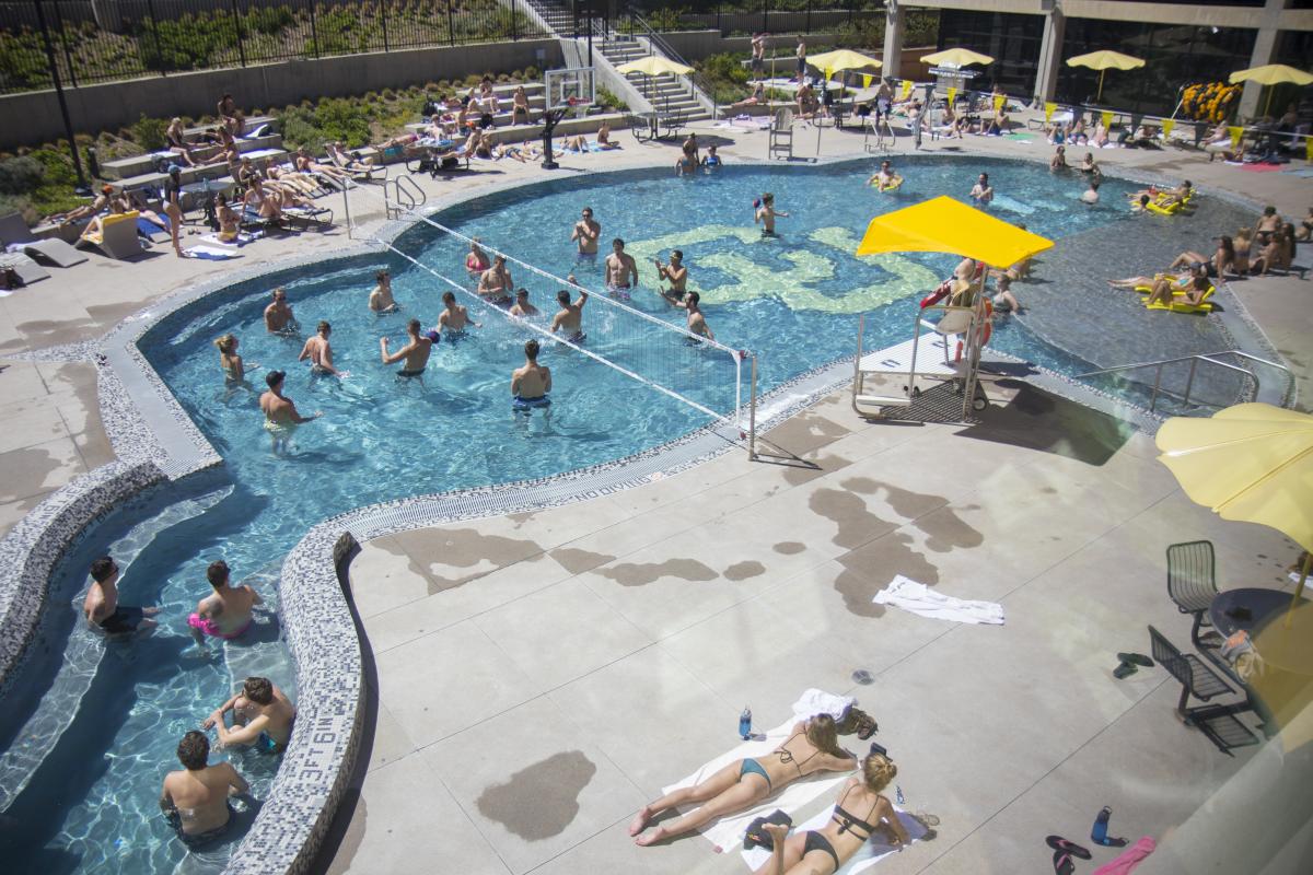 Student swim in the Buff Pool on campus