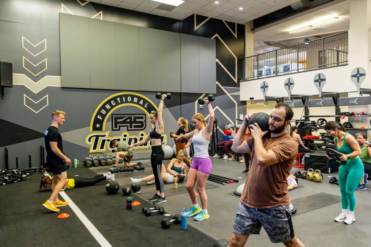 Students participate in a F45 fitness class at the Rec Center