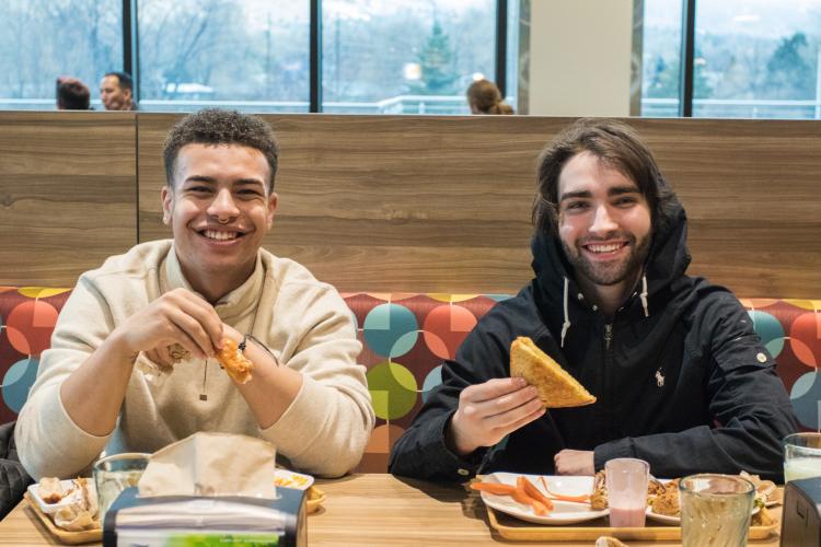Two people eating food